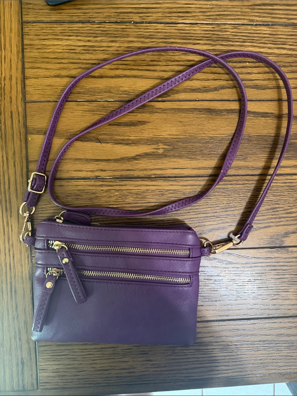 Compact Purple Leather Crossbody Handbag with Gold Hardware